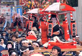 Celebrities parade in Osaka for business prosperity